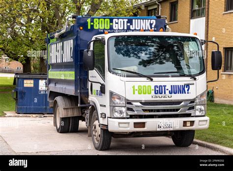 1-800-GOT-JUNK truck and team providing waste removal for residential move in Ontario