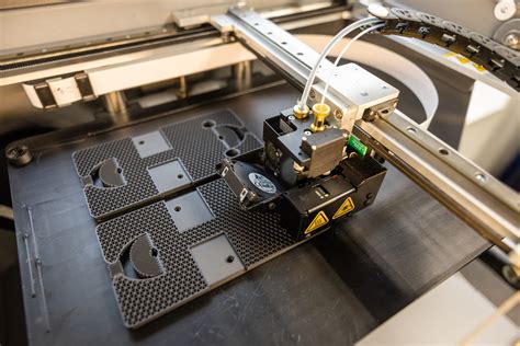 3D printed aerospace part undergoing tensile testing in lab setting