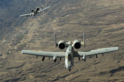 A-10 close air support mission over urban battlefield providing support to ground forces