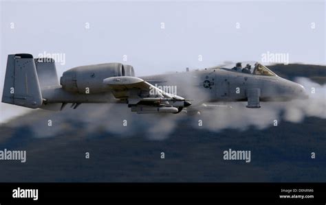 A-10 firing GAU-8 at armored vehicles battlefield strike