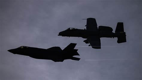 A-10 Warthog and F-35 Lightning II in flight military contrast