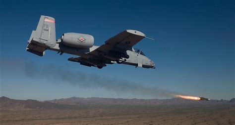 A-10 Warthog firing AGM-65 Maverick missile in desert combat exercise