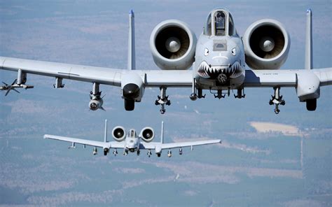 A-10 Warthog formation flying with modern fighter jets contrast