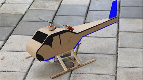 A small toy-style coaxial RC helicopter on a table, illustrating a beginner model