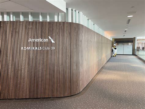 Admirals Club entrance with AA branding and premium entryway