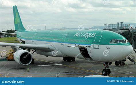 Aer Lingus Airbus A330-300 parked at Dublin Airport beside transatlantic gates