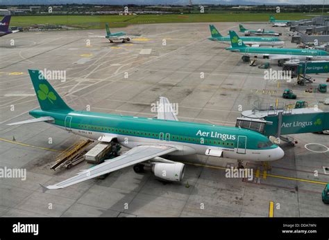 Aer Lingus aircraft parked at Dublin Airport with Terminal 2 in background