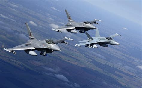 Aerial combat between F-16 and F/A-18 during multinational military exercise