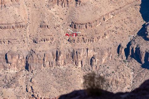 Aerial film crew inside helicopter over Boulder canyon