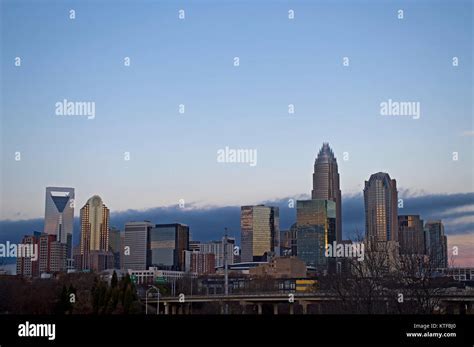 aerial photo of Charlotte Uptown skyline with helicopter shadow cast on building façade