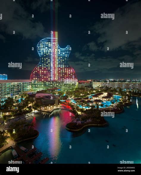 aerial shot of Hard Rock Hotel Guitar Tower illuminated at night from a helicopter