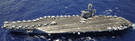aerial shot of nimitz class carrier operating without refuel across pacific