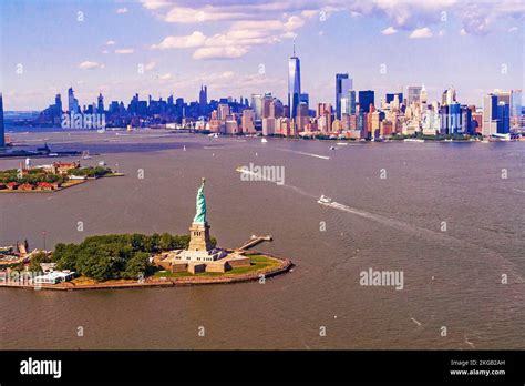 aerial view from blade helicopter of statue of liberty and manhattan skyline