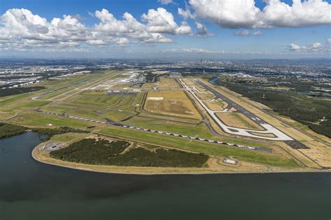 aerial view of Brisbane Airport showcasing dual runways and terminals