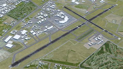 aerial view of Christchurch International Airport with snow-capped Southern Alps in distance