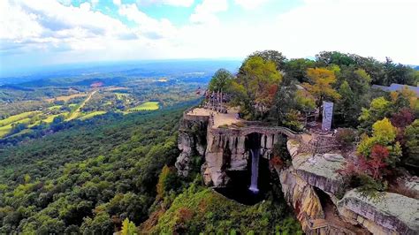 aerial view of Lookout Mountain, Ruby Falls entrance, and surrounding forest from helicopter