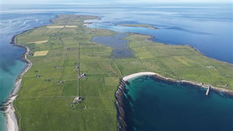 aerial view of papa westray’s prehistoric ruins and coastline