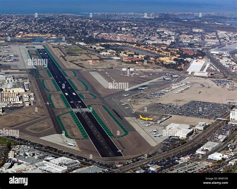 aerial view of San Diego International Airport with downtown backdrop