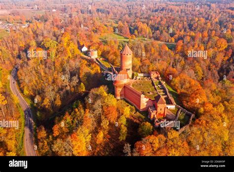 aerial view of sigulda castle ruins in autumn colors