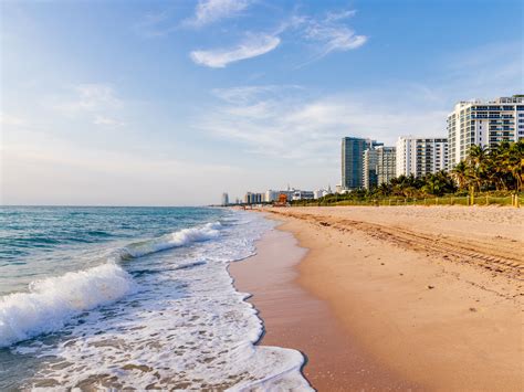 aerial view of south beach with pastel art deco buildings and lifeguard huts