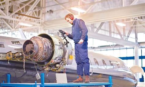 aerospace manufacturing engineer reviewing Parker system design schematics