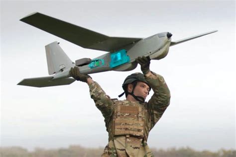 AeroVironment Switchblade 300 in pre-launch configuration with U.S. soldiers