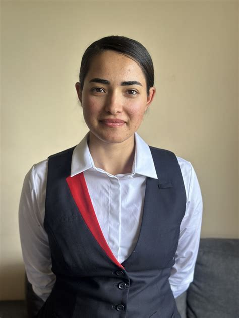 Afghan refugee Bibi Zahra working at Qantas Lounge in Adelaide with Accor team