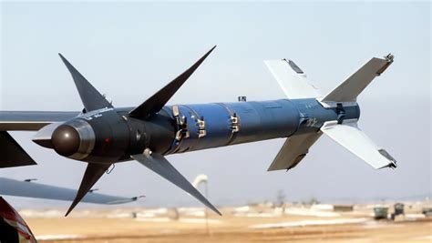 AGM-114R Hellfire missile being loaded onto M299 launcher during maritime operations drill