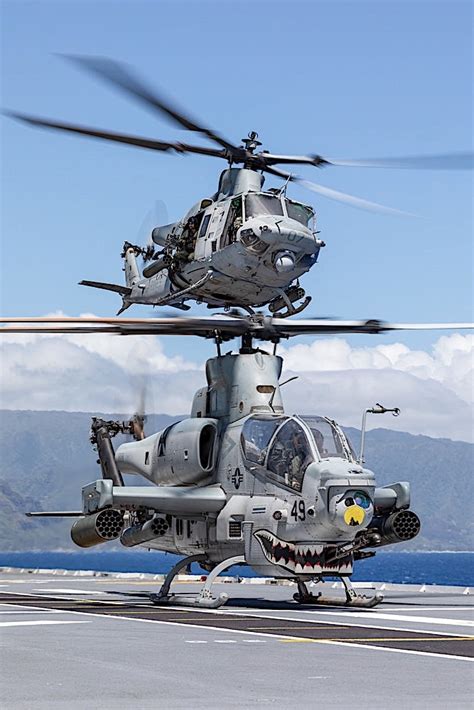 AH-1Z Viper helicopter with extended front refueling probe at forward operating base