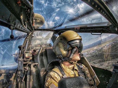 ah-64 apache pilot inside armored cockpit during mission