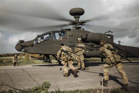AH-64E Apache operating at low altitude during a modern deep attack training mission