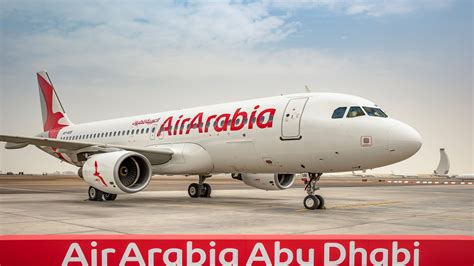 air arabia abu dhabi aircraft taxiing with abu dhabi skyline in background