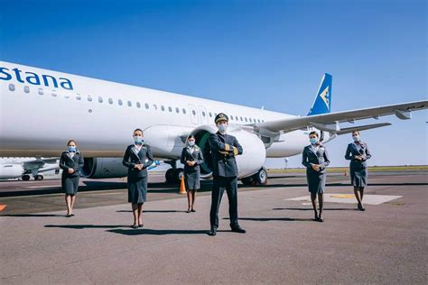 Air Astana cabin crew wearing pandemic safety gear
