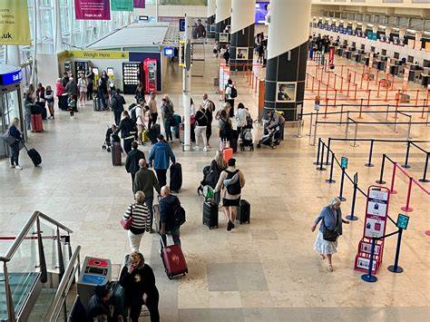 air austral check-in counter at reunion airport with passengers in queue