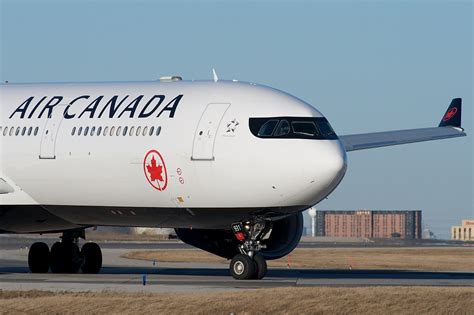 air canada a330 over prague cityscape