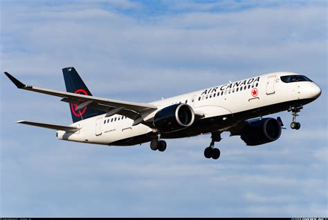 Air Canada Airbus A220-300 landing in Seattle during sunset