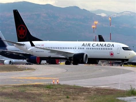 air canada aircraft on tarmac as cross-border routes suspended
