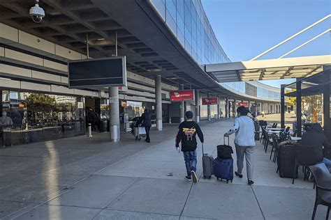 Air Canada airport operations busy summer travel passengers terminal check-in