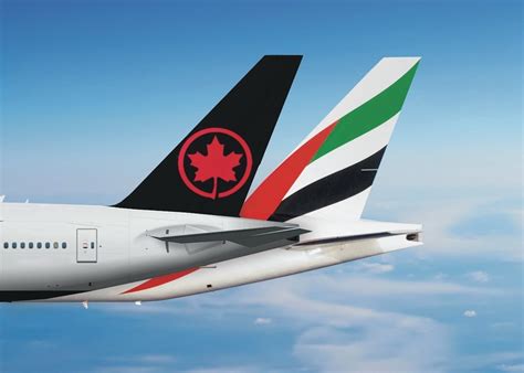 Air Canada and ITA Airways CEOs shaking hands at Rome Fiumicino announcement hall