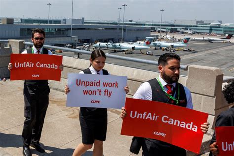 air canada flight crew with flags at edinburgh airport inaugural ceremony