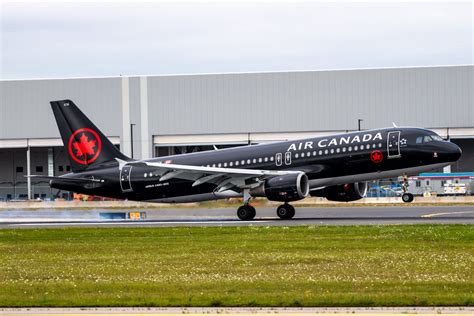 Air Canada Jetz Airbus A320 black livery taxiing at Montreal airport