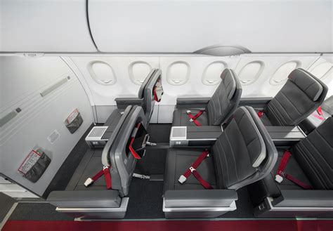 air canada rouge premium recliner seats and inflight entertainment screen