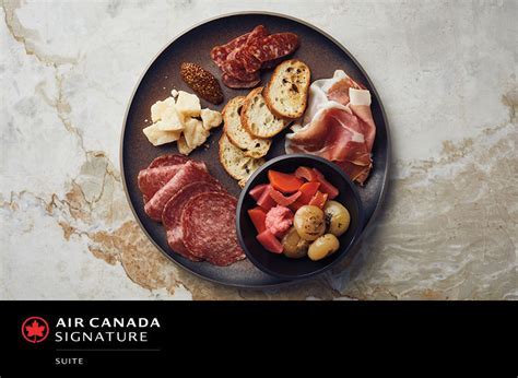 air canada toronto signature suite interior with gourmet meal