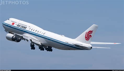 air china aircraft landing in auckland with tourism branding