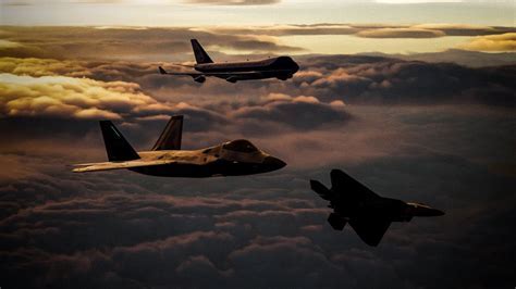 Air Force One soaring above the clouds with escort jets
