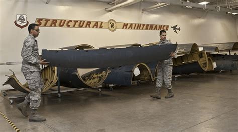 air force structural airman working on metal framework during overseas deployment
