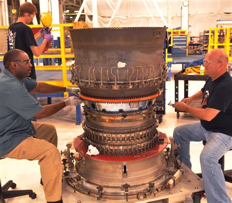Air Force technicians analyzing F119 engine digital maintenance data