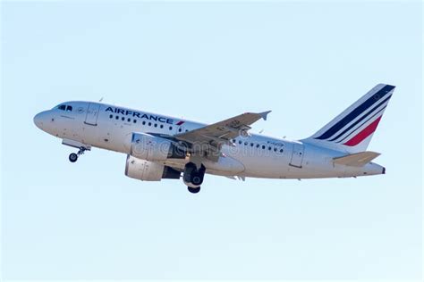 air france airbus a318 taking off at charles de gaulle airport with visible engines