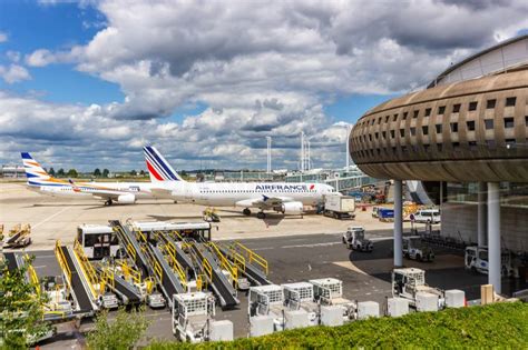 Air France and Delta aircraft parked at Paris Charles de Gaulle hub terminal