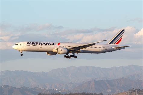 Air France Boeing 777-300ER landing at JFK under overcast sky